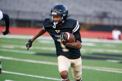 Greene County senior wideout Jordan Knox tries to dodge defenders during a scrimmage against Northeast (Macon) on Aug. 8. LANCE McCURLEY/Staff