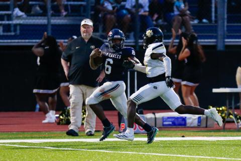 Putnam County senior running back Omarion Butts (6) runs past a Greene County defender on his way to the end zone. LANCE McCURLEY/Staff