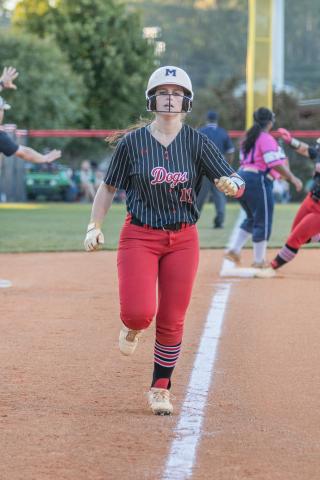 Morgan County's Ryleigh Hilsman races toward home plate to score a run. SKYLA MORRIS/Staff