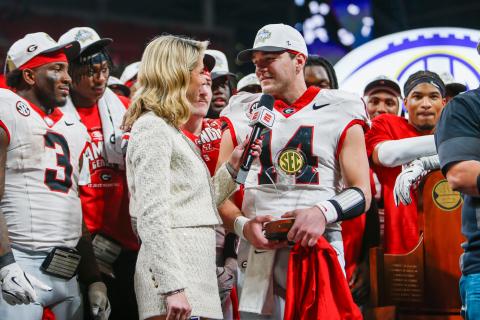 ESPN reporter Laura Rutledge (left) interviews Georgia quarterback Gunner Stockton (right) following the SEC Championship game. LANCE McCURLEY/Staff