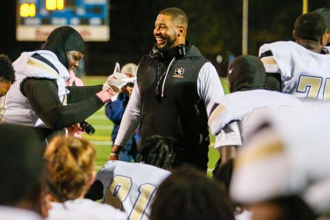 Greene County head football coach Darius Robinson celebrates with his team after the Tigers defeated Lake Oconee Academy on Oct. 24 in their regular-season finale. LANCE MCCURLEY/Staff
