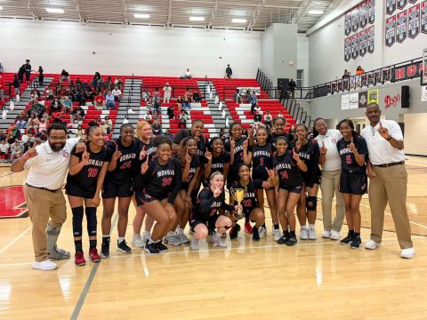 The Morgan County girls basketball team poses for a photo after defeating Westside (Macon) in the region championship on Feb. 20. SKYLA MORRIS/Staff