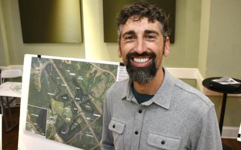 Hans Dawson displays the site plan for the proposed quarry. IAN TOCHER/Staff