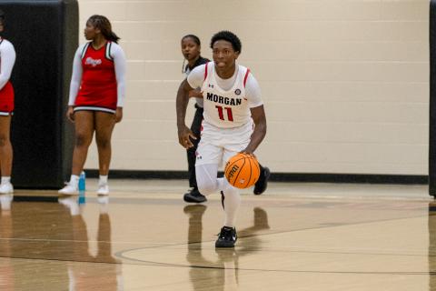 Morgan County senior Zeki Locus (11) pushes the ball up the floor in transition against Tattnall County on Feb. 28. SKYLA MORRIS/Staff