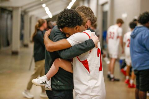 Morgan County head coach Cody Anderson and senior point guard Jacoby Simmons hug after the team defeated in the Class 2A state championship on March 14. LANCE McCURLEY/Staff