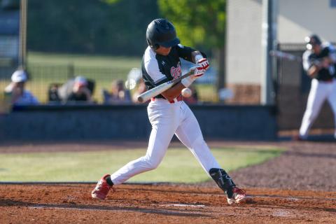 Morgan County slugger Gavin Hunt squares up a pitch, putting the barrel of the bat on the ball during an at-bat against Oconee County on April 15. LANCE McCURLEY/Staff