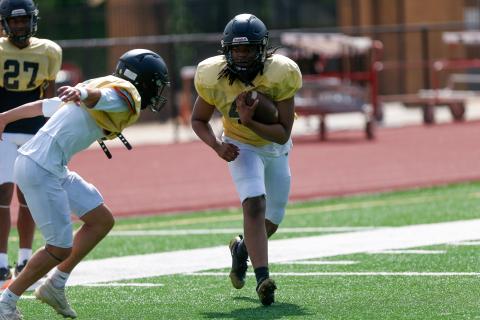 Greene County rising senior Cameron Parker participates in a drill focused on ball security. LANCE McCURLEY/Staff