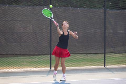 As part of the No. 1 doubles team, Lindsey Young lines up a serve. SKYLA MORRIS/Staff