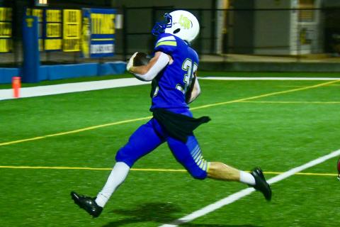 Lake Oconee Academy running back Griffin Stanford races untouched into the end zone for one of his four touchdowns against Mount Pisgah. IAN TOCHER/Staff