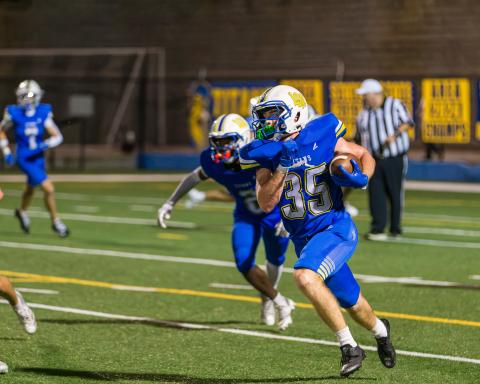 Titans senior running back Griffin Stanford runs on a kick return against the War Eagles. SKYLA MORRIS/Staff