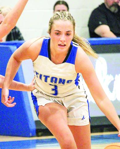 Lake Oconee Academy senior Georgia Bosart (3) drives the lane against Christian Heritage hoping for a basket. TREY NORRIS/Staff