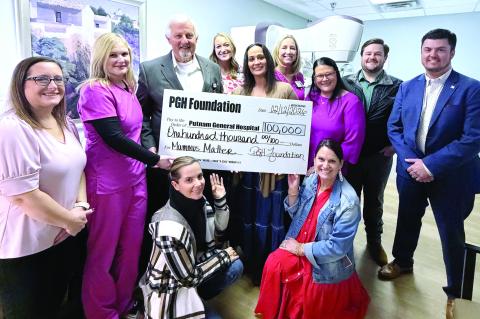 Putnam General Hospital leaders and staff pose earlier this month with a sizable contribution from the PGH Foundation on behalf of local donors. SKYLA MORRIS/Staff