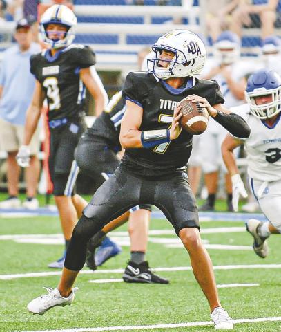 Titans’ quarterback Ike O’Neal (7) sits in the pocket ready to launch a pass downfield to an open receiver. CHARLES JORDAN/Contributed