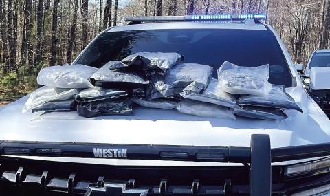 What started as a traffic stop ended with a man and dog in custody after the discovery of 15 vacuumsealed bags filled with approximately one pound of marijuana each. CONTRIBUTED