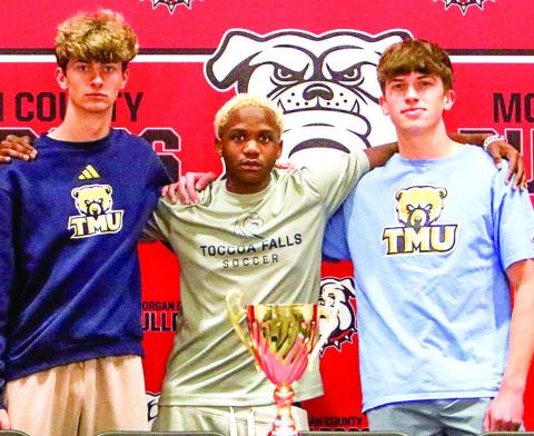 L-R: Morgan County senior soccer players Blake Downs, Teddy Young, and Chase Link all signed to play at the next level during a ceremony on Friday, April 18. LANCE MCCURLEY/Staff