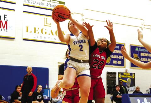 Junior guard Ansleigh Padgett takes a shot over a Bulldogs defender. LANCE McCURLEY/Staff