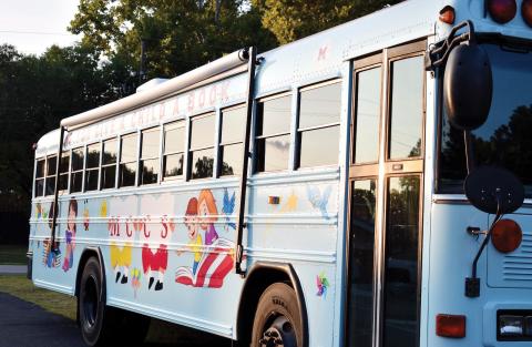 The Morgan County Board of Education unveils its literacy bus, themed around “If You Give a Child a Book.” (HANNAH BARRON/Staff)