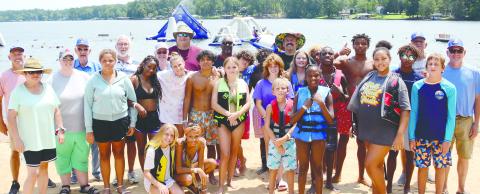 Last Saturday, members of Eatonton’s Rising Star Lodge #4 hosted staff and residents of the Masonic Home of Georgia at Oconee Springs Park. In between playing on the park’s giant inflatable water toys and going for boat rides on Lake Sinclair, the kids enjoyed barbequed hamburgers, hot dogs and ice-cold drinks provided and prepared for them by local Masons. IAN TOCHER/Staff