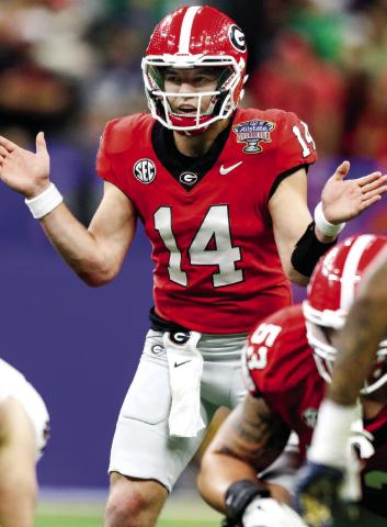 Georgia quarterback Gunner Stockton (14) gets set to snap the ball during the third quarter of the Allstate Sugar Bowl against Notre Dame. LANCE MCCURLEY/Staff