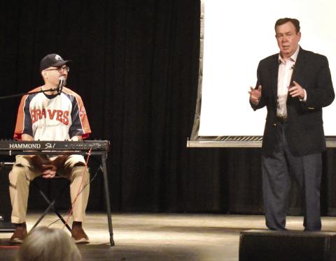 Atlanta Braves organist Matthew Kaminski (left) teamed up with “Mr. College Football” Tony Barnhart to entertain and talk some ‘ball with sports fans last Tuesday at Greensboro’s historic Festival Hall. T. MICHAEL STONE/Staff