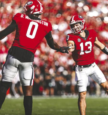 Georgia tight end Darnell Washington (0) led the team in receiving against Vanderbilt, making the most of opportunities from quarterback Stetson Bennett (13). TONY WALSH/UGA Athletics