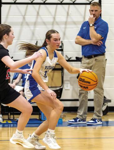 New Lake Oconee Academy girls head basketball coach Josh Seymour watches a play develop in front of him, as the Lady Titans hosted Oglethorpe SKYLA MORRIS/Staff