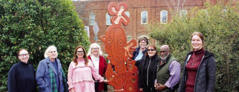 The “All These Mixed Emotions” sculpture is unveiled in Madison’s Town Park by city staff and members of Madison’s Public Arts Commission (PAC), including (l-r) Jill Reale, staff; Emmie Smock, PAC; Sherri-Aynn Collins, PAC; Jennifer King Lockridge, PAC; Mollie Bogle, staff; Emily Smeltzer, PAC; Vic Jackson, PAC; and Sarah Wibell, staff. CONTRIBUTED
