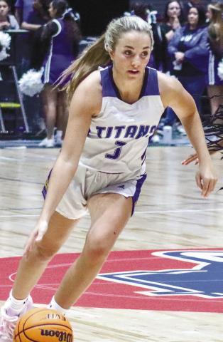 Titans guard Georgia Bosart (3) drives to the basket during the first half of the GHSA Class 1A, Division II State Championship last weekend. LANCE McCURLEY/Staff