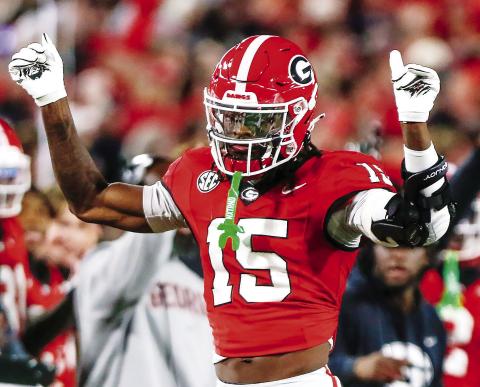 Georgia cornerback Demello Jones (15) totaled four tackles, including being credited with half a tackle for loss and a pass breakup against the Longhorns. LANCE McCURLEY/Staff