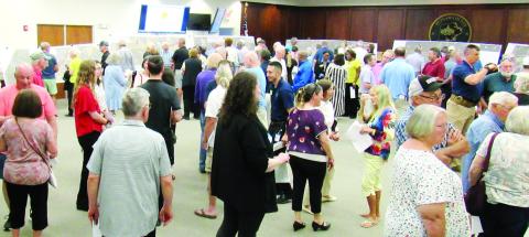 Residents, business owners and community leaders attended the GDOT open house at the Putnam County Administration building on Tuesday, May 7 to see the latest plans for the widening of Highway 44. The project could start early next year. (MARK ENGEL/Staff)