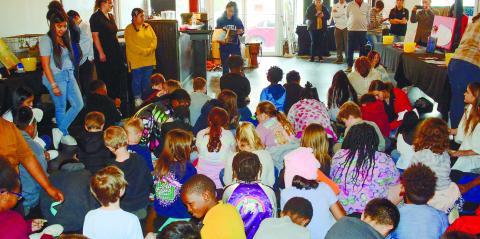 Putnam High students line the edges of the room at the Live and Drive Book Fair they organized and presented March 10, at Georgia Writers Museum.