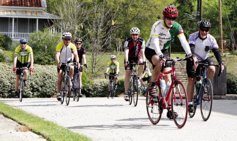 Riders pedal into downtown Union Point during a past Ticket to Ride event. This year, Union Point will host its start, finish, and SAG location at Union Pharmacy, including food trucks from 11 a.m. to 2 p.m. CONTRIBUTED