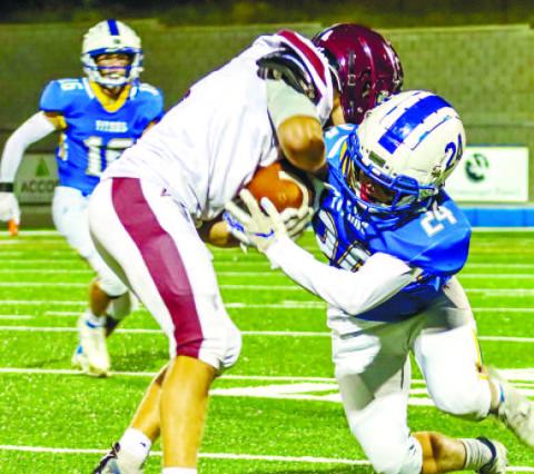 A Lake Oconee Academy defender (24) strikes Cherokee Christian quarterback Jeremiah Meder (11). LANCE McCURLEY/Staff