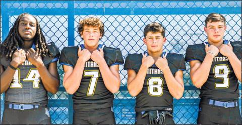 Ja’Quon Hall (14), Ike O’Neal (7), Cameron Kelley (8), and Reid Davis (9) are some of the Titans’ playmakers that want to continue to improve the Lake Oconee Academy program. CHARLES JORDAN/Staff
