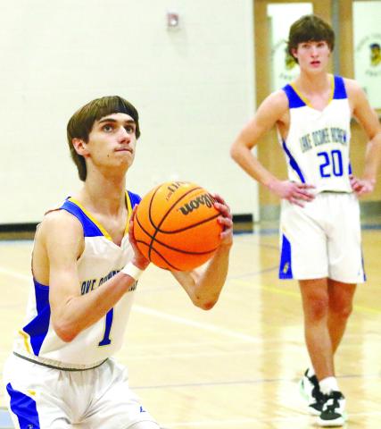 Titans’ senior William Goss (1) gets set to take a free throw attempt last Tuesday night against the Jaguars. BRENDAN KOERNER/Staff