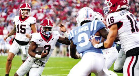Georgia running back Nate Frazier (3) scored the Bulldogs’ lone touchdown early in the game. TONY WALSH/UGAAA