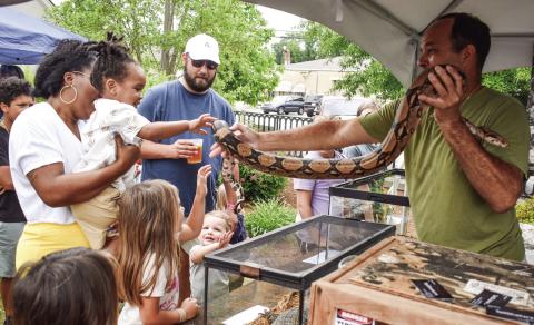 David Burke brought out the boa to the delight of some children and unmitigated terror of others. (T. MICHAEL STONE/Staff)