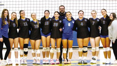 Lake Oconee Academy’s volleyball team poses for a photo after defeating Bryan County in the first round of the state playoffs. WILL MORRISON/Staff