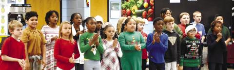 Third graders sing “We Wish You a Merry Christmas.” BAILEY McCULLY/Staff