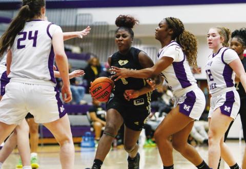 Greene County’s Jessaria Porter (0) drives to the basket. She scored a team-high 22 points in the win over Monroe Area on Feb. 1. LANCE MCCURLEY/Staff