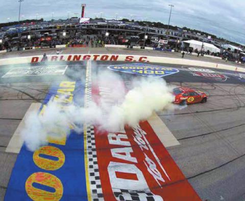 Joey Logano, driver of the #22 Shell Pennzoil Ford, celebrates with a sweet burnout after winning the Cup Series Goodyear 400 at Darlington Raceway Sunday. (Emilee Chen/Getty Images)