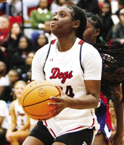 Morgan County’s Cydney Burke (24) attempts to shoot a jump shot in last week’s loss to Putnam County. LANCE McCURLEY/Staff