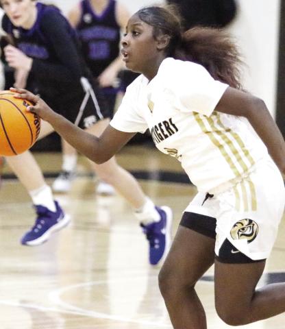 Greene County guard Jesaria Porter brings the ball up the floor in transition against Towns County. LANCE MCCURLEY/Staff