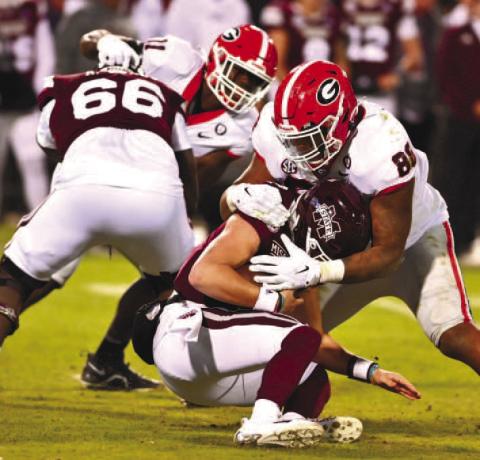 Georgia defensive linemen Jalen Carter (88) sacks Mississippi State quarterback Will Rogers during Saturday’s game in Starkville, Miss. ROB DAVIS/UGA Athletics