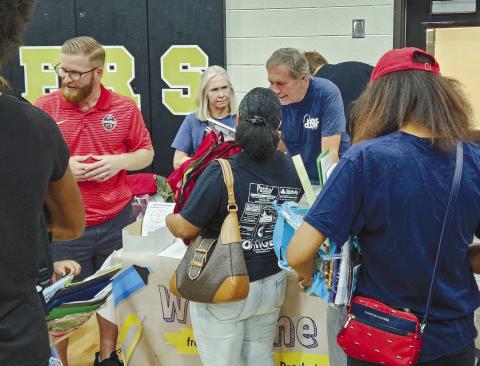 Vendors talk with Greene County students and parents. CONTRIBUTED