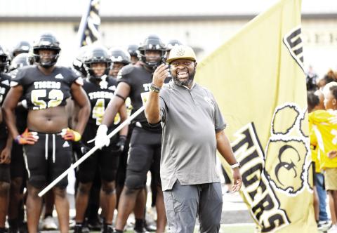Greene County head coach Terrance Banks prepares to lead his team out of the tunnel before the Tigers’ season-opener against rival Morgan County last year. (LANCE McCURLEY/Staff)
