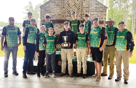 The coaches and student-athletes of Gatewood’s middle school shotgun team pose with the winning hardware Oct. 13, after securing their fourth-consecutive state championship at the GIAA Middle School Shotgun Invitational in Savannah. CONTRIBUTED