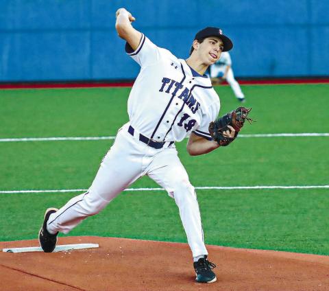 Garrett Payne (18) gets set to deliver a pitch from the mound in a loss to Jasper County last season. FILE PHOTO