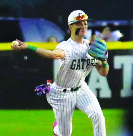 Gatewood senior Ames Johnson tries to make a force out at first base after making a play on an infield ground ball. TREY NORRIS/Staff