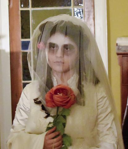 Sylvia, the famed ghost of Panola Hall, greets visitors during Haunted Eatonton. HANNAH BARRON/Staff